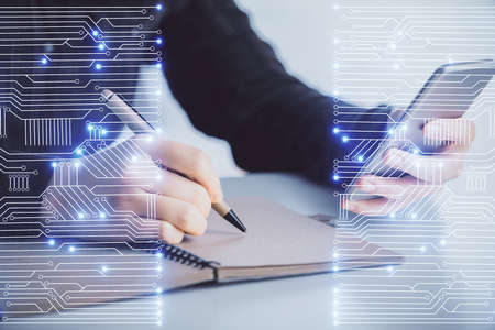 Double exposure of tech icon hologram and woman holding and using a mobile device. Technology concept.の写真素材