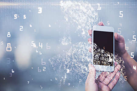 Double exposure of tech icon hologram and woman holding and using a mobile device. Technology concept.の写真素材