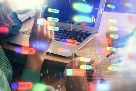 Double exposure of man and woman working together and technology theme drawing hologram. Big data...
