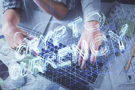 Double exposure of man and woman working together and crypto theme hologram drawing. Computer background. Blockchain concept. Top View.の写真素材