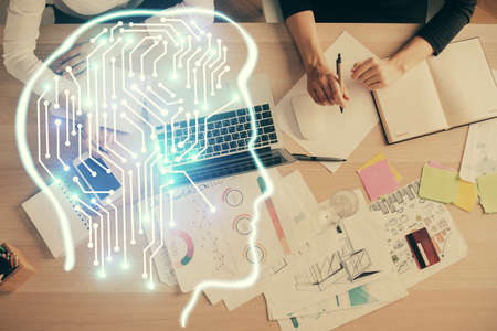 Double exposure of woman working on computer andhuman brain hologram drawing. Top View. Ai concept.の写真素材