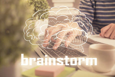 Double exposure of woman hands typing on computer and creative drawing. Start up concept.の写真素材