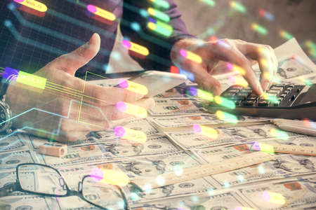 Multi exposure of man's hand holding and using a digital device and data theme drawing. Innovation concept.の写真素材