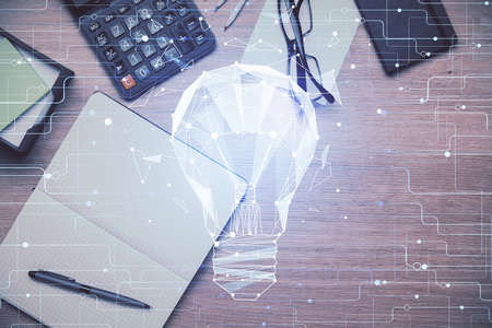 Double exposure of bulb drawing and work table top veiw. Concept of idea.