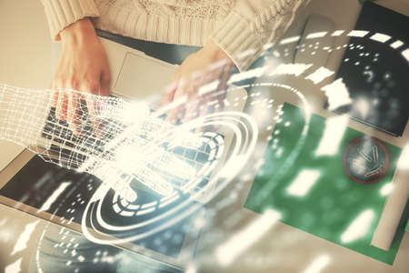 Double exposure of woman hands working on computer and data theme hologram drawing. Top View....