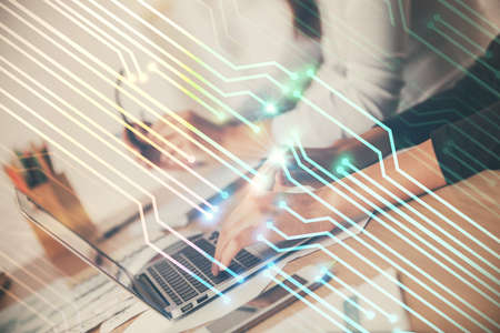 Double exposure of woman hands working on computer and data theme hologram drawing. Tech concept.
