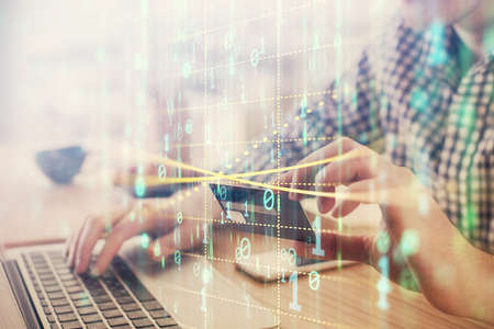 Double exposure of man hands holding a credit card and data theme drawing. E-commerce and technology concept.の写真素材