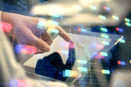 Multi exposure of man's hand holding and using a digital device and data theme drawing. Innovation concept.の写真素材