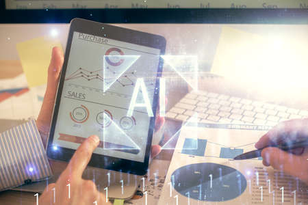 Multi exposure of man's hands holding and using a digital device and data theme drawing. Innovation concept.の写真素材