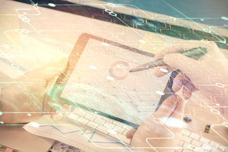 Multi exposure of man's hands holding and using a digital device and data theme drawing. Innovation...