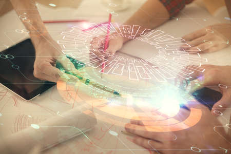 Double exposure of data theme hologram drawing and man and woman working together holding and using...