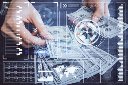 Multi exposure of technology drawing hologram and us dollars bills and man hands. Data conceptの写真素材