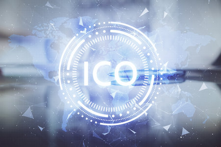 Double exposure of crypto currency theme drawing hologram over coffee cup background in office. Concept of international blockchain.の写真素材