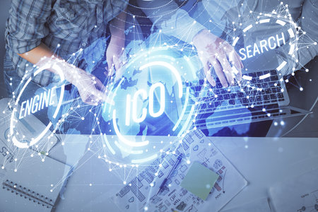 Double exposure of man and woman working together and crypto theme hologram drawing. Computer background. Blockchain concept. Top View.の写真素材