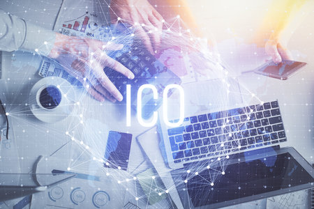 Double exposure of man and woman working together and crypto theme hologram drawing. Computer...