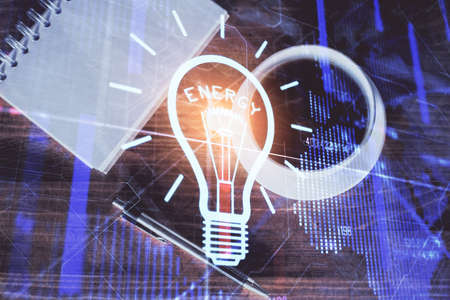 Double exposure of bulb drawing and work table top veiw. Concept of idea.