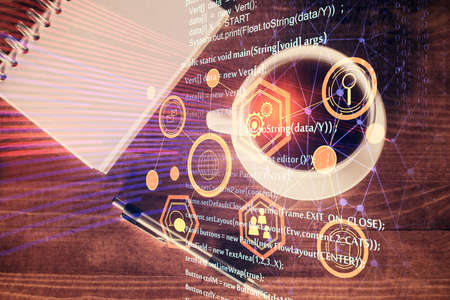 Double exposure of technology theme drawing over work table desktop. Top view. Global data analysis...