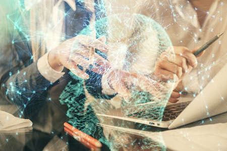 Double exposure of man and woman working together and brain drawing hologram. Intellectual...