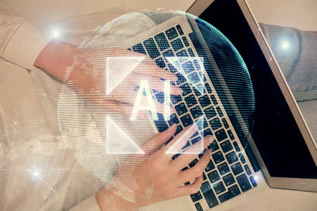 Double exposure of woman hands working on computer and data theme hologram drawing. Top View. Technology concept.の写真素材