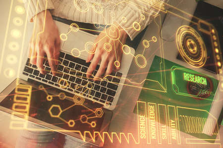 Double exposure of woman hands working on computer and data theme hologram drawing. Top View....