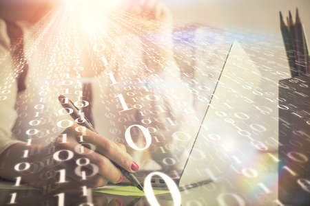 Multi exposure of woman hands working on computer and data theme hologram drawing. Tech concept.