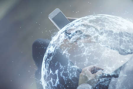 Double exposure of man's hands holding and using a phone and social network theme drawing.の写真素材