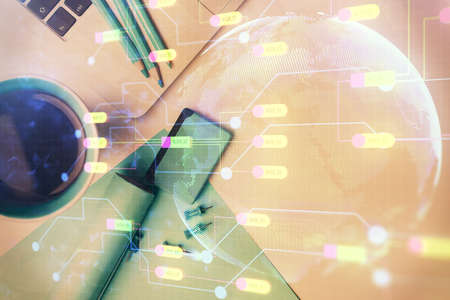 Multi exposure of data drawing hologram over topview of study desk background with computer. Concept...