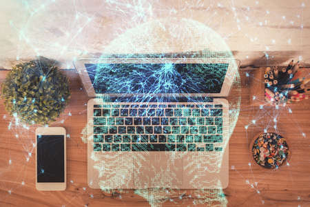 Multi exposure of brain sketch hologram over topview work table background with computer. Concept of big data.の写真素材
