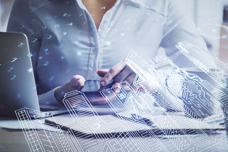 Double exposure of buildings hologram and woman holding and using a mobile device. Smart city concept.の写真素材
