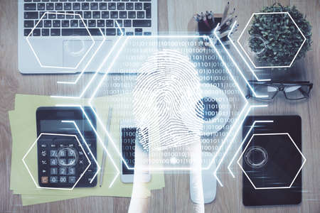 Double exposure of finger print over table with phone. Top view. Concept of mobile security.