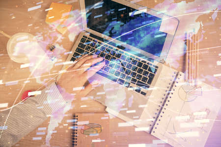 Multi exposure of man's hands typing over computer keyboard and data theme hologram drawing. Top...