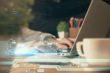 Double exposure of woman hands working on computer and data theme hologram drawing. Tech concept.