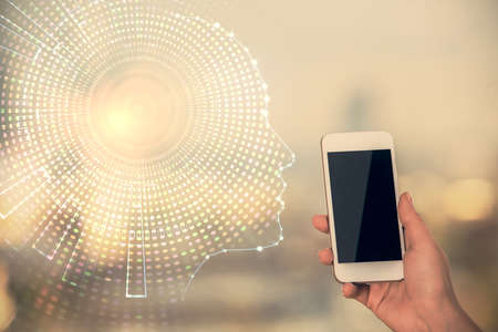 Double exposure of brain sketch hologram and woman holding and using a mobile device.の写真素材