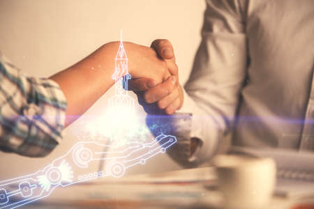 Multi exposure of creative drawing hologram and handshake of two men. Start up concept