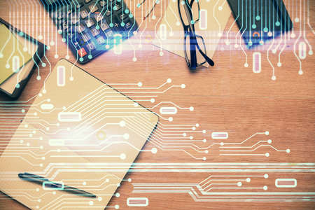 Double exposure of technology theme drawing over work table desktop. Top view. Global data analysis...