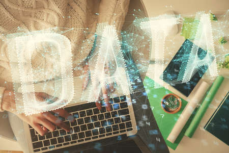 Double exposure of woman hands working on computer and data theme hologram drawing. Top View....