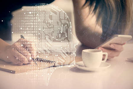 Double exposure of brain sketch hologram and woman holding and using a mobile device.の写真素材