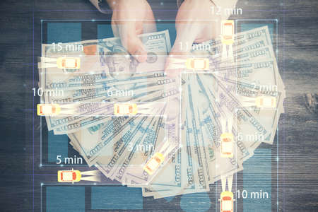 Multi exposure of Tech taxi drawing hologram and USA dollars bills and man hands. Technology concept.の写真素材