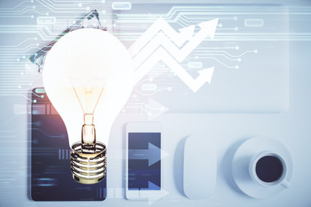 Double exposure of bulb drawing over table with phone. Top view. Concept of idea.の写真素材