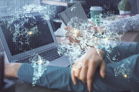 Double exposure of man and woman working together and social network theme hologram drawing. People...