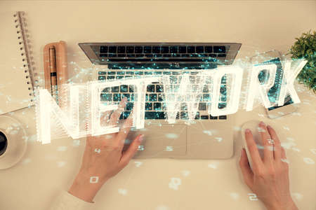 Double exposure of woman hands working on computer and data theme hologram drawing. Top View....
