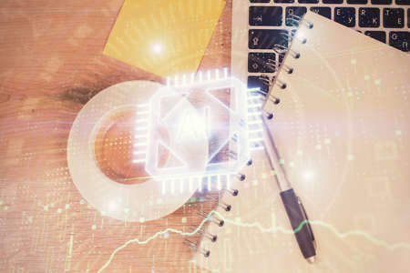 Double exposure of data drawing hologram over topview of study desk background with computer....