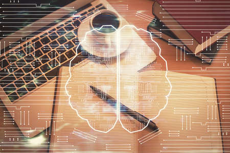 Double exposure of brain drawing hologram over topview work table background with computer. Concept...