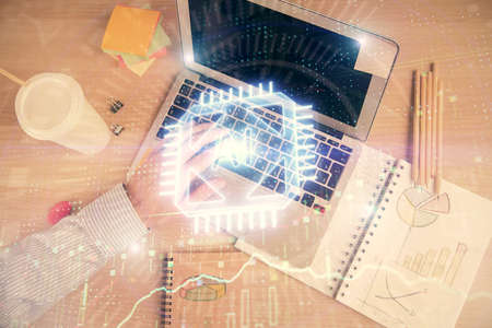 Multi exposure of man's hands typing over computer keyboard and data theme hologram drawing. Top view. Technology concept.の写真素材
