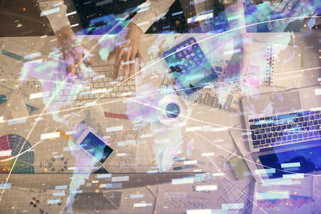 Double exposure of man and woman working together and data theme hologram drawing. Computer...