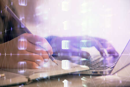 Multi exposure of woman hands working on computer and data theme hologram drawing. Tech concept.