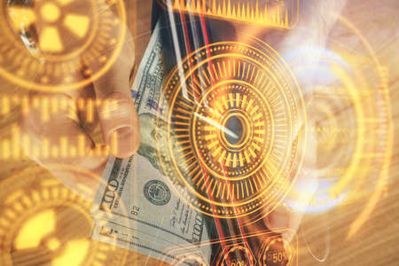 Multi exposure of Tech drawing hologram and USA dollars bills and man hands. Technology concept.