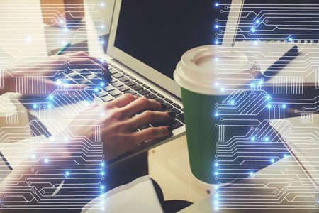 Double exposure of woman hands typing on computer and technology theme drawing. High Tech concept.