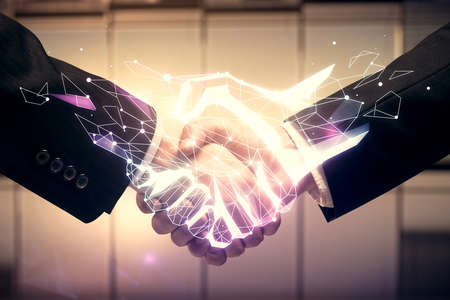 Double exposure of hand shake drawing hologram and handshake of two men.の写真素材