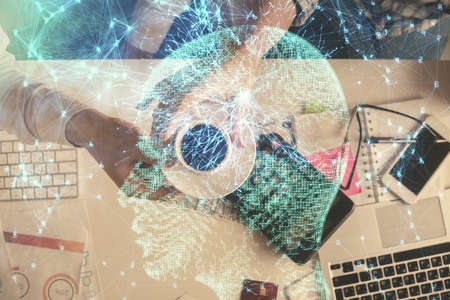 Double exposure of man and woman working together and human brain hologram drawing. Brainstorm...